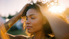 Woman running her fingers through her hair