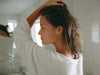 women hand rubbing hair